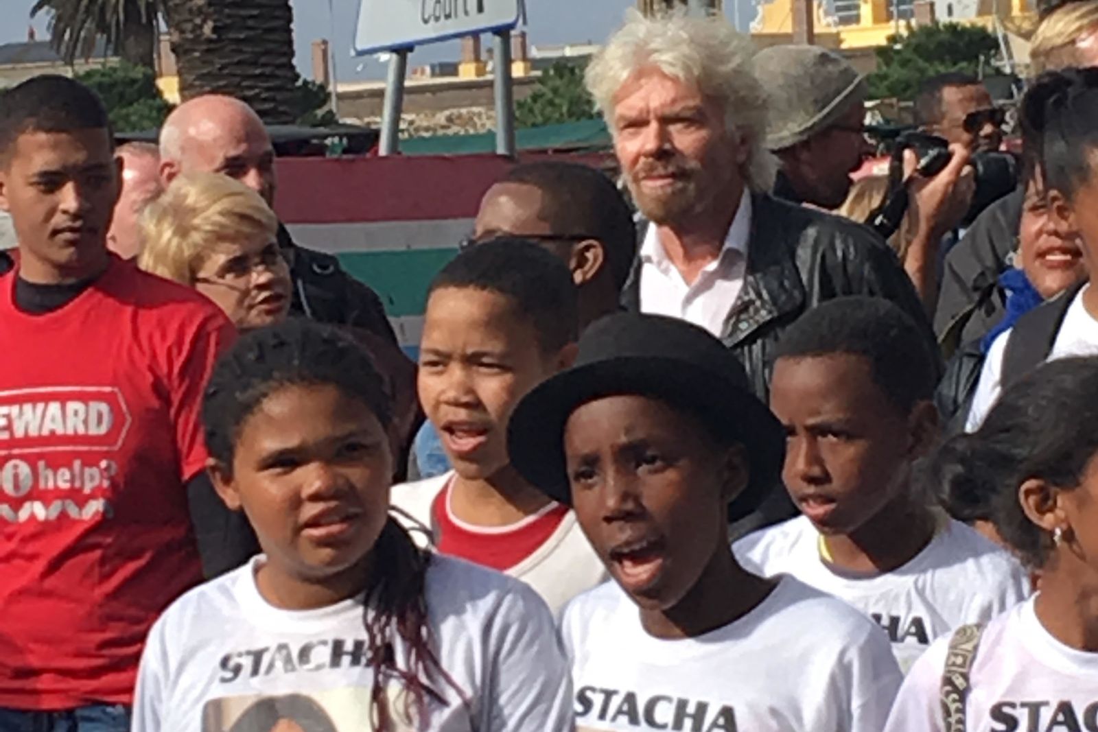 Richard Branson with children from the Mitchells Plain Crisis Forum community group